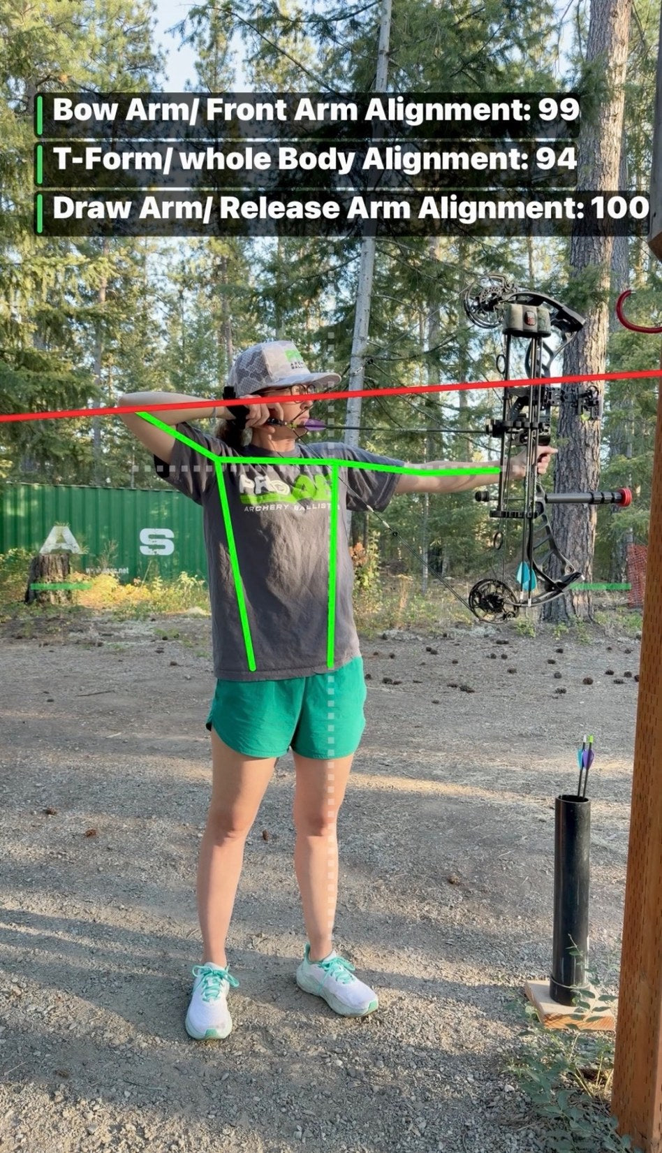 Actual archer at full draw with real-time Shot Doctor alignment scores and tracking overlays